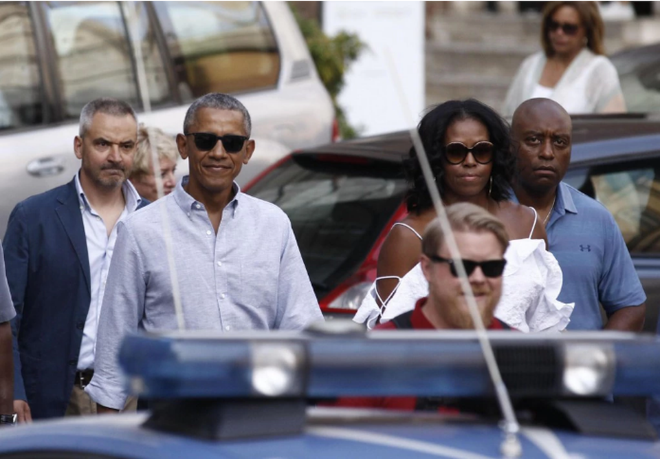 Hai vợ chồng ông Obama dạo bước tại Siena, Italy ngày 22/5 (Ảnh: Fabio Di Pietro)