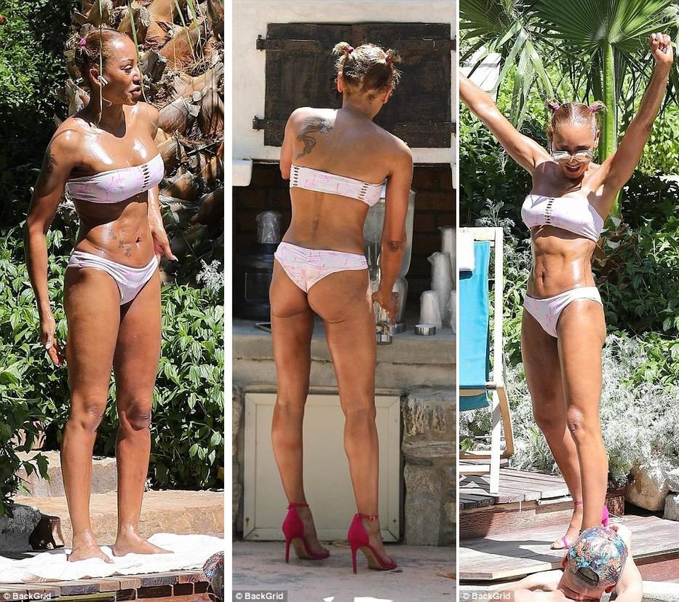 Mel B khoe thân hình cơ bắp sau 3 lần sinh nở - 16
Trong một ngày khác, Mel B diện bộ áo tắm màu trắng, giày cao gót màu hồng sải bước tự tin trong khu nghỉ dưỡng.