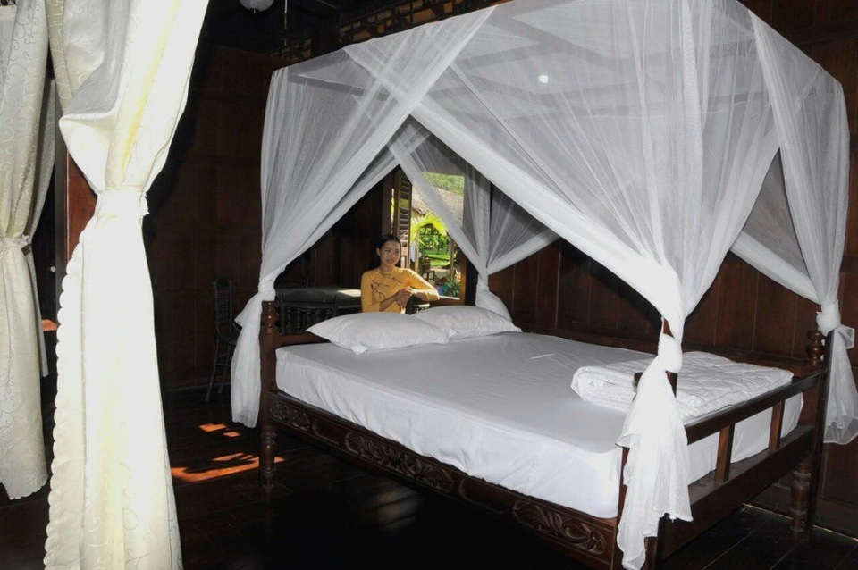 Dịp lễ, các điểm du lịch homestay ở Đồng Tháp hút khách - 1 Phòng ngủ tại Nhà sàn trong khu du lịch homestay Làng Hòa An rất thoáng mát và sạch sẽ