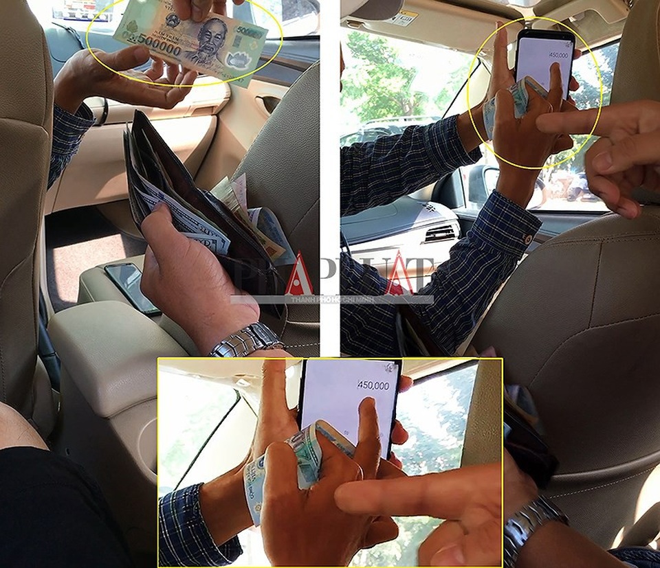 Chiêu trò "đồng 500.000 có ma" của các taxi dù - 1
Tài xế taxi dù 51G-503.52 tráo tờ 500.000 đồng của khách thành tờ 20.000 đồng. (Ảnh cắt từ clip) Ảnh: N.TÂN