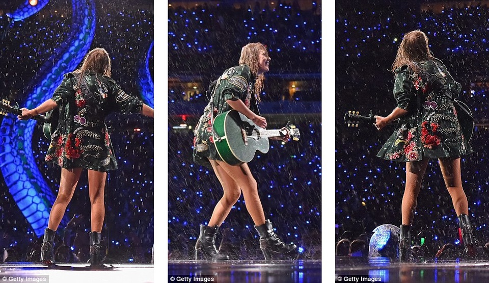 Taylor Swift “dầm mưa” suốt hai tiếng trong liveshow - 9 Chơi ghita dưới mưa.
