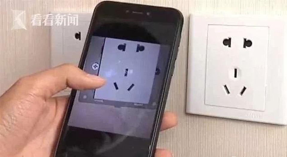 Cặp đôi phát hiện camera quay lén giấu trong ổ điện khách sạn - 3