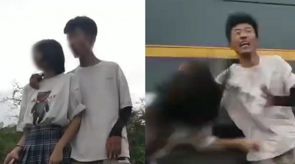 Sốc clip khoảnh khắc cặp đôi suýt bị tàu tông vì đứng gần đường sắt để quay video - 1 Sốc clip khoảnh khắc cặp đôi suýt bị tàu tông vì đứng gần đường sắt để quay video - 1