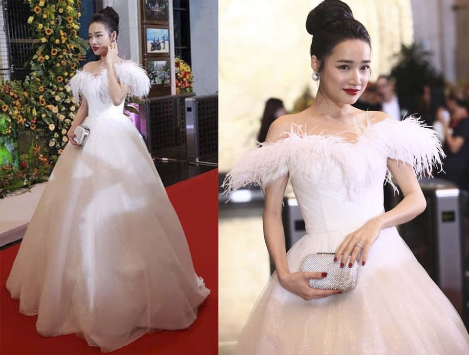 Hoàng Thuỳ đụng hàng “tóc Hồng Ngọc” 20 năm trước; Nhã Phương xuất hiện sau tin đồn bầu bí - 3 Sau khi trở về Quảng Nam làm lễ đính hôn, Nhã Phương liên tục xuất hiện với những bộ cánh ôm sát. Nếu tuần trước là đầm 2 dây thì tuần này lại là đầm công chúa thắt eo cực gắt, như ngầm khẳng định tin đồn bầu bí chỉ là “hư cấu”.