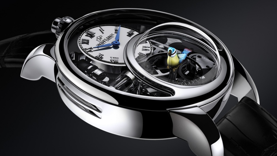 Chuyến dừng chân của Jaquet Droz Charming Bird và Bird Repeater tại Việt Nam - 4 The Charming Bird nổi bật với mặt đồng hồ với biểu tượng số 8 hộ mệnh cho sự trường tồn và may mắn nay được biến tấu thành một mái vòm sapphire, ôm lấy chú chim xanh bé nhỏ đang vỗ cánh và cất tiếng hót trong trẻo.