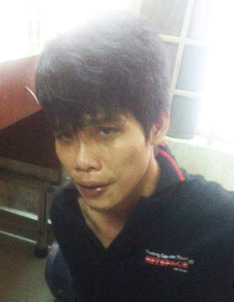 Tên cướp Nguyễn Dương Hoàng Phúc tại trụ sở Công an (ảnh Song Ngân)