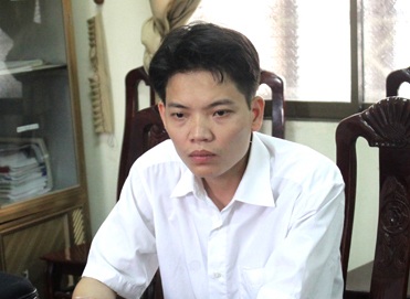 Trần Văn Trung tại cơ quan điều tra (ảnh H. Thành).