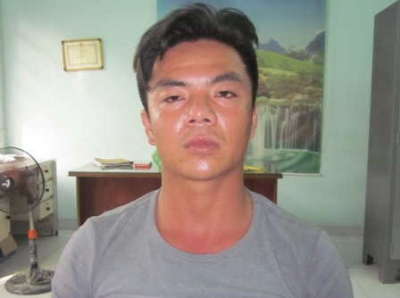 Trần Quang Trinh tại cơ quan công an