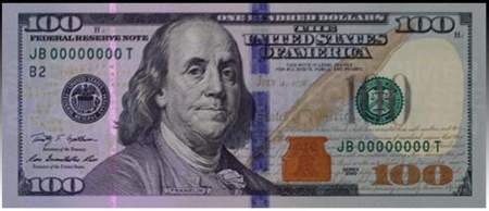 Tờ 100 USD mới khi được chiếu đèn cực tím