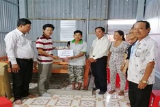 Readers help build house for ailing man and son