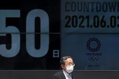 Olympics chief says cancellation unlikely as 10,000 volunteers quit