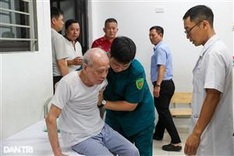 Storm-threatened Hanoi evacuates residents from deteriorating apartment block