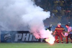 Woman injured by flares at Hanoi football clash