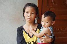 Little girl struggles to raise small sister