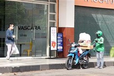 HCM City allows food and drink takeaway services, reopens IT stores