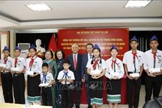 Scholarships given to disadvantaged oversea-Vietnamese students in Laos
