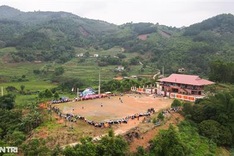 Ethnic women play football at spring festival