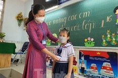 All students in HCM City return to school after 10 month absence