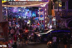 Popular HCM City street bustling again