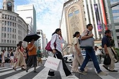 Japan scraps idea to woo women out of city with cash