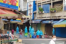 HCM City to pilot treating Covid-19 patients at home