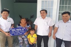 Grandmother and grandson welcome new house