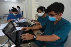 Medical staff busy at Ho Chi Minh City biggest Covid-19 field hospital