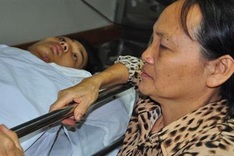 Cancer mother takes care of hospitalised son