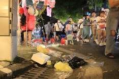 Hang Ma Street covered in rubbish after Full Moon Festival