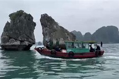 Boat vendors return to hassling tourists on Ha Long Bay