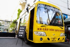 Young people support HCM City students with barber bus