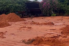 Red sand spills onto Phan Thiet street
