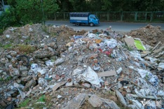 Hanoi road engulfed in rubbish