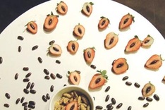 Art exhibition exposes food on plates, waiting people