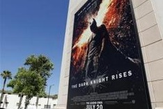 "Dark Knight Rises" earns $160.8 million in debut