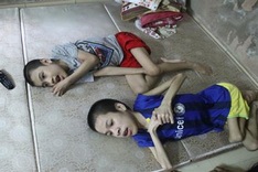 Poor woman seeks help for paralysed children, injured husband