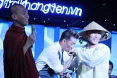 Singer punished for monk charity event kiss
