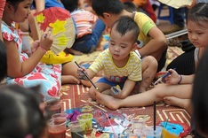 Children make Mid-Autumn Festival masks