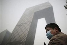 China must cut pollution by half before environment improves: official