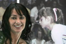 Ex-gymnast Comaneci takes flame on London tour