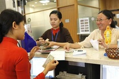 Students run towards the money