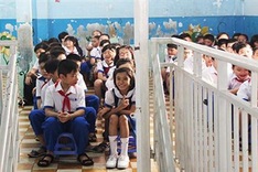School holds flag-raising ceremony on top floor due to limited space