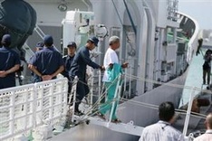 Japan police to hand pro-China group to immigration