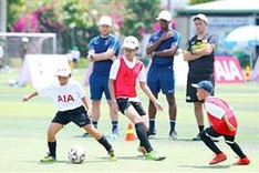 English football coaches train kids in Vietnam