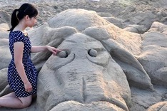 Making sand statues on My Khe Beach