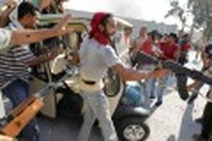 Libya rebels destroy symbols of Kadafi's power