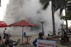 One dies as fire spreads in trade centre