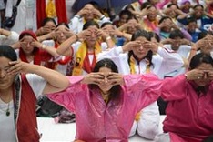 Yoga connecting world, says Modi as millions stretch and bend