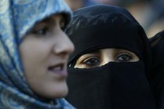 British college drops Muslim veil ban amid outcry