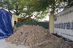 People dump soil in front of company to protest environmental violations